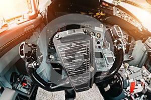 Aircraft cockpit handwheel view on the control panel.