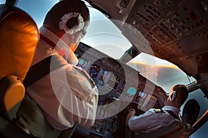 Aircraft cockpit. The pilots of the passenger plane at work.