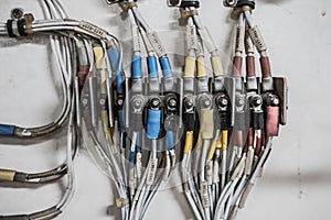 Aircraft electrical system displayed on white background in aircraft maintenance classroom with many colorful wires