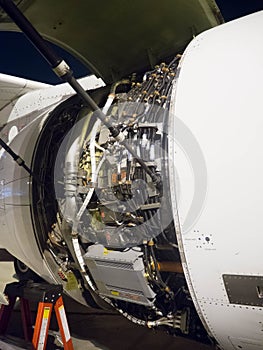 Aircraft engine cowling opened showing engine control units, FADEC and other units