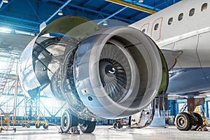 Aircraft engine jet on the wing during maintenance in the hangar