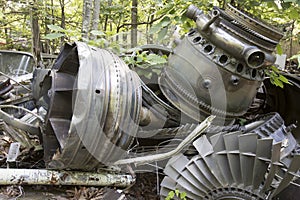 Aircraft engine parts rusting in junkyard