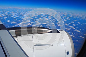 Aircraft engine and wing on the border of atmosphere and space. The edge of the troposphere. Horizon over the Earth