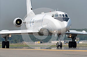 Aircraft with engines at the tail taxis on the steering track