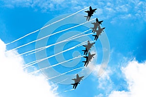 Aircraft fighter jets smoke the background of blue sky white clouds