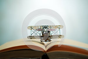 aircraft figther on open book with abstract light studious student, education, concept.