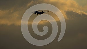 Aircraft on final approach at sunset