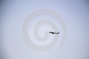 Aircraft flying through the blue sky