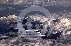 Aircraft flying over clouds