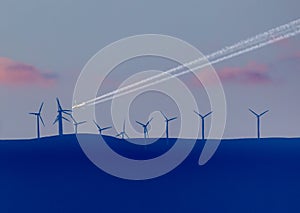 Aircraft flyng over windfarm