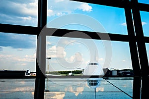Aircraft framed by airport windows