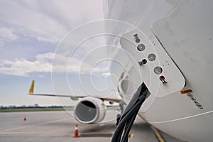 Aircraft on the ground being supplied with electricity