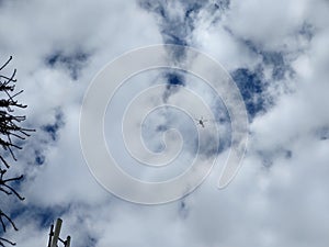 Aircraft or helicopter in the sky or on the aeroport during the day.