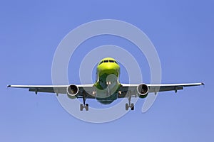 Aircraft with landing gear on the background of the sky photo