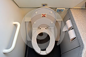 Aircraft lavatory toilets