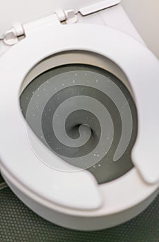 Aircraft lavatory toilets aboard a jetliner airplane .