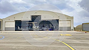 Aircraft maintenance hangar full of bussiness jets photo