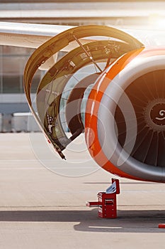 Aircraft Maintenance Inspection and Working on Airplane Jet Engine on Apron.