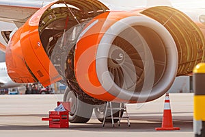 Aircraft Maintenance Inspection and Working on Airplane Jet Engine on Apron.