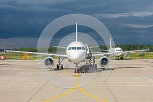 Aircraft maintenance parked in the open air airport, engine repair and mechanics check testing