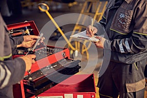 Aircraft mechanics staying in the aviation hangar