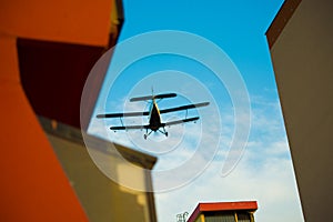 Aircraft over houses- mosquito spraying