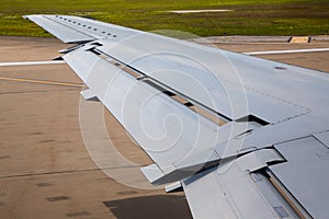 Aircraft plane wing taking off on airport