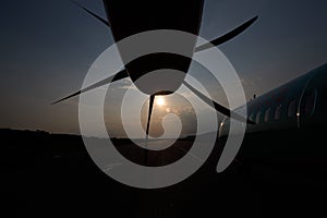 Aircraft propeller. Outside view. Sunset and plane.