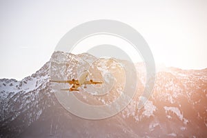 Airplane scenery:  take off from airport, mountain range in the alps. Travel by air, transportation photo