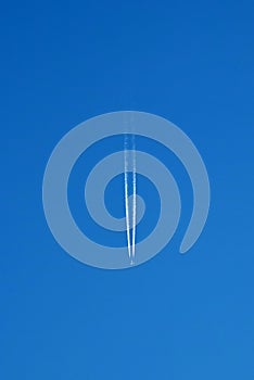 Aircraft Vapour Trail With Blue Sky Background