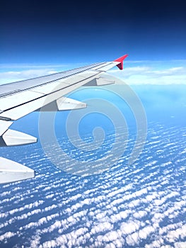 Aircraft Wing over marshmallow clouds