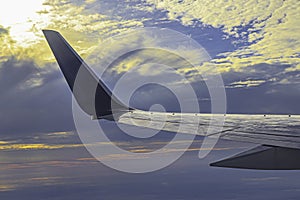 Aircraft Wing and Winglets in Colorful Sky