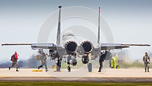 Aircrew arming F15 fighter jet