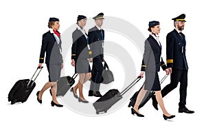 Aircrew with travel bags walking isolated on white background