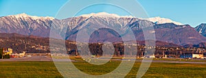 Airdrome of Sochi International Airport on background of mountains