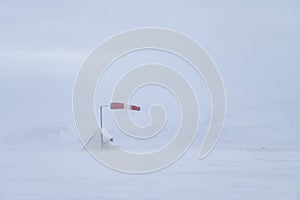 Airfield windsock in driving snow, Northern Iceland