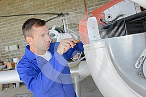 Airframe mechanic inside hangar