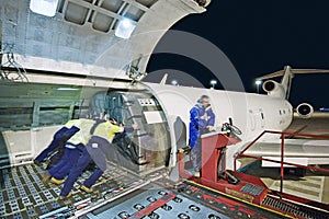 Airfreight loading onto Boeing 727 photo