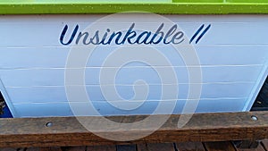 Close Up Of Boat Name Unsinkable