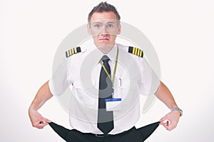 Airline captain pilot showing his empty pockets