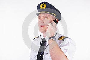 Airline captain pilot talking on the phone