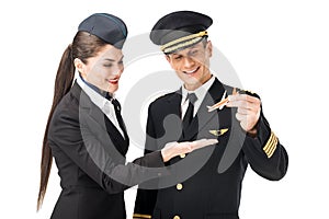 Airline captain and stewardess holding toy plane