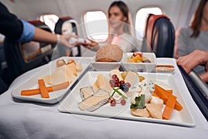 Airline meal for passengers standing on serving cart