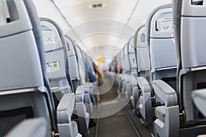 Airline passenger seats and aisle in airplane