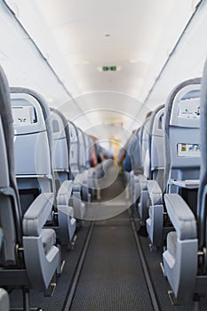 Airline passenger seats and aisle in airplane