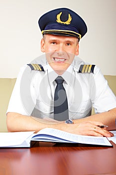 Airline pilot filling in papers in ARO