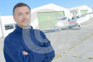 airline pilot standing near aircraft