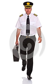 Airline pilot walking carrying flight case.