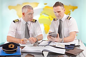 Airline pilots filling in papers in ARO