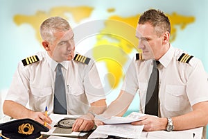 Airline pilots filling in papers in ARO